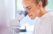 Medical scientist examining test samples
