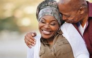 A man and a woman are embracing