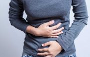 A person is holding their stomach