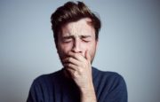 Fatigued man yawning