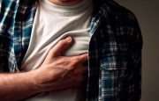 A man is holding his chest