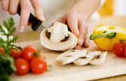 A person is cutting a mushroom