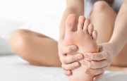 Person examining feet