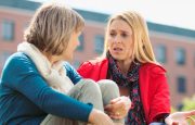 Two women are talking to each other