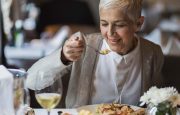 A woman is eating out at a restaurant