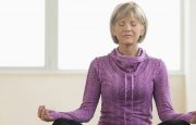 A woman is practicing yoga