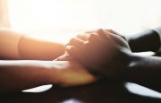 Hands comforting each other
