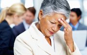 A woman is experiencing a headache