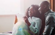 A pregnant woman is with a man