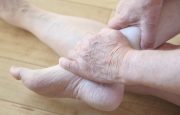 Hands holding ankle and foot