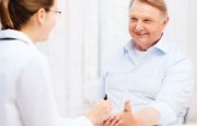 Doctor is talking to her male patient
