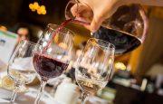 Wine is being poured into a glass
